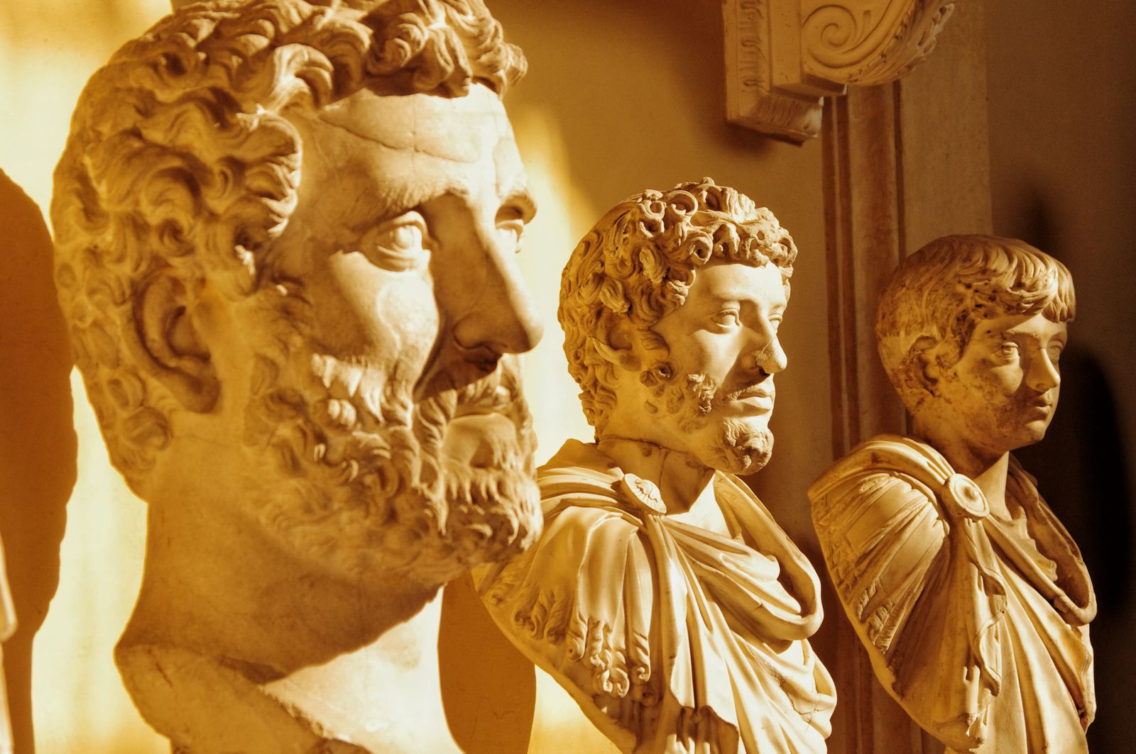 Ancient Roman marble sculptures displayed in a Rome museum, showcasing classical art and culture.